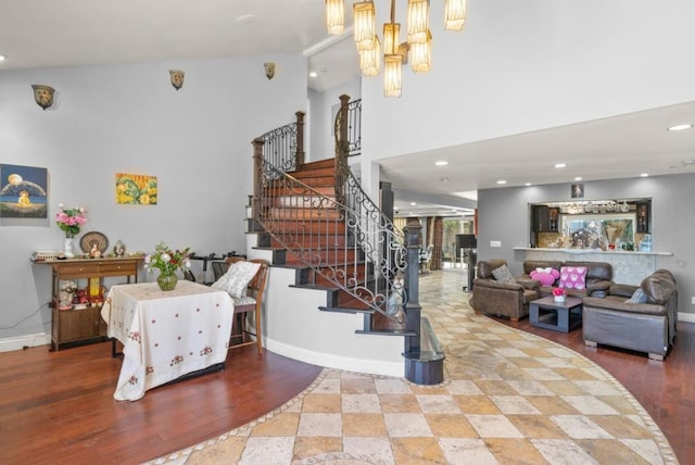 staircase with hardwood / wood-style floors