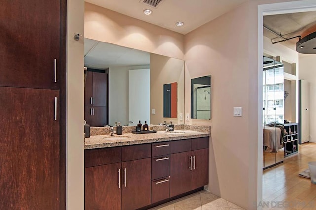 bathroom featuring vanity and wood-type flooring