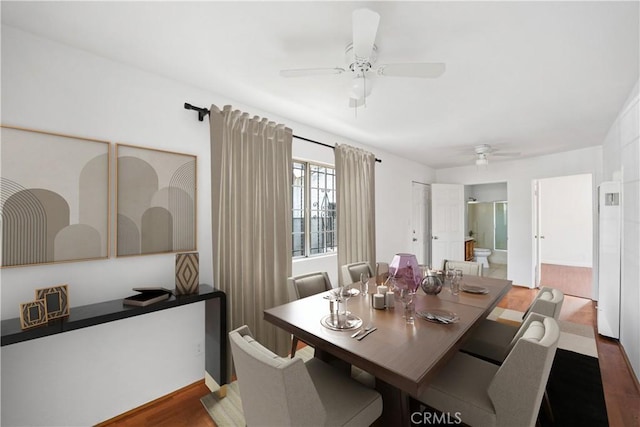 dining area featuring dark hardwood / wood-style floors and ceiling fan