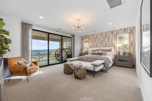 bedroom featuring access to exterior, light colored carpet, and a notable chandelier