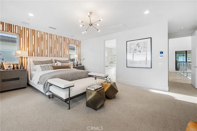 bedroom featuring light carpet, ensuite bathroom, an inviting chandelier, and multiple windows