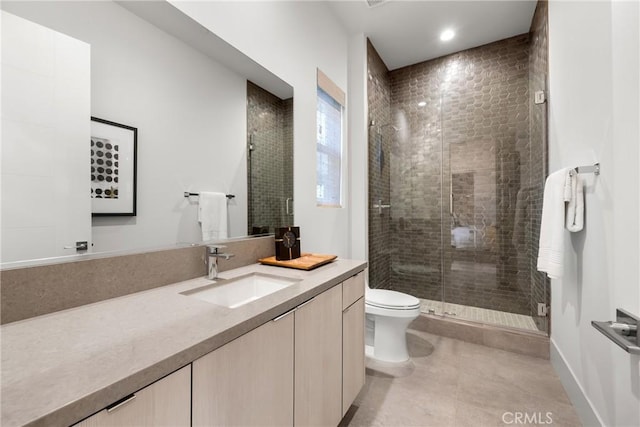 bathroom with vanity, toilet, and walk in shower