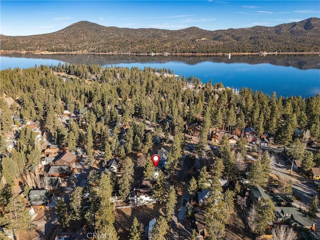 aerial view featuring a water and mountain view