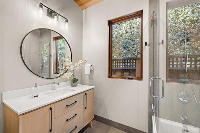 bathroom featuring vanity and an enclosed shower