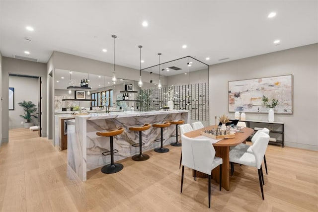 dining room with light hardwood / wood-style flooring