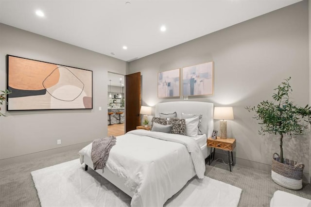 bedroom with light colored carpet