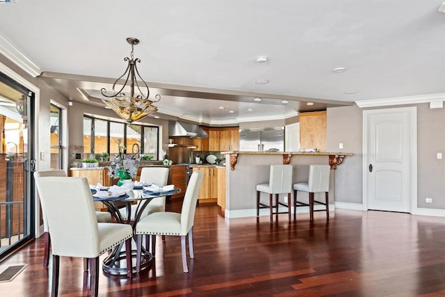 dining room with ornamental molding, dark hardwood / wood-style floors, and a notable chandelier