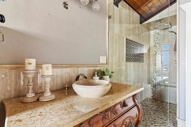 bathroom featuring vanity, wood ceiling, lofted ceiling, and walk in shower