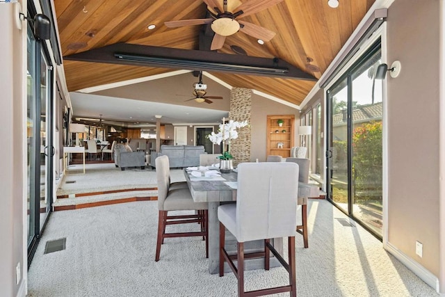 dining space with light carpet, lofted ceiling with beams, ceiling fan, and wood ceiling