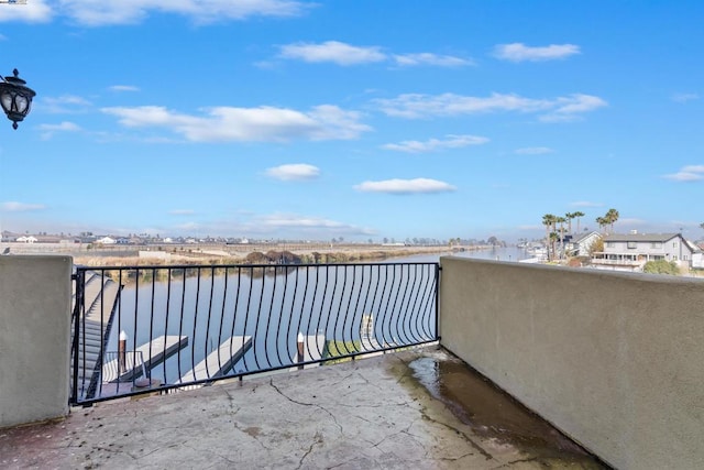 balcony featuring a water view