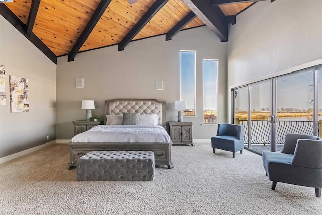 bedroom with carpet flooring, beamed ceiling, high vaulted ceiling, and wooden ceiling