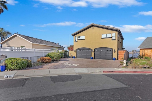 view of side of home featuring a garage