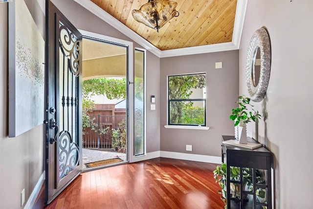 foyer with a healthy amount of sunlight, hardwood / wood-style floors, and wood ceiling