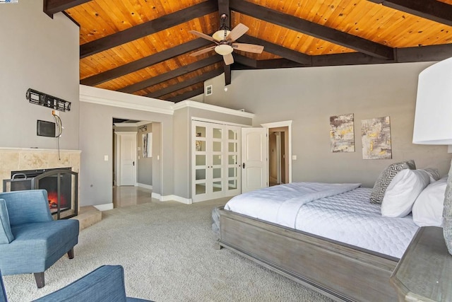 bedroom featuring beam ceiling, carpet floors, wooden ceiling, and high vaulted ceiling