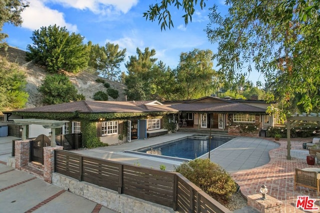 view of pool with a patio and area for grilling