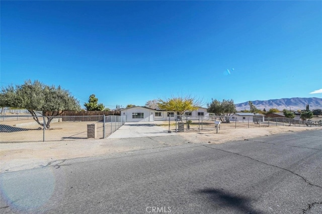 view of front of property with a mountain view