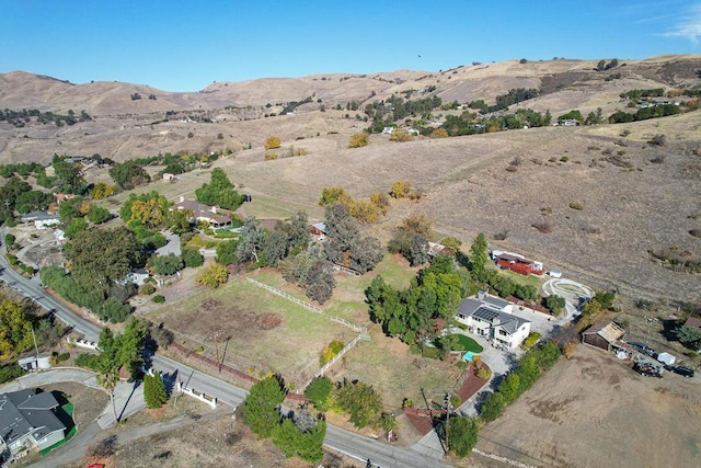 birds eye view of property with a mountain view