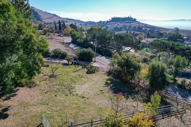 drone / aerial view featuring a rural view and a mountain view