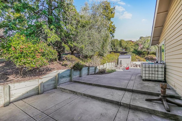 view of patio / terrace featuring a storage unit