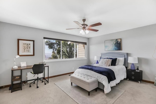 bedroom featuring ceiling fan and light carpet