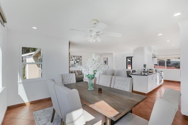 dining room featuring ceiling fan and light tile patterned floors