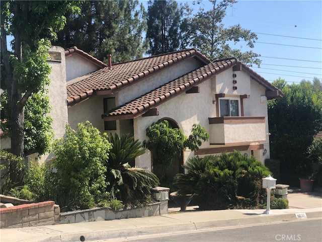 mediterranean / spanish-style house with a balcony