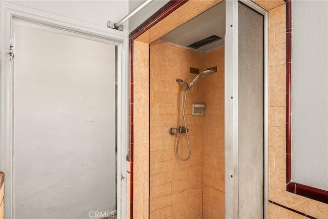 bathroom with tiled shower