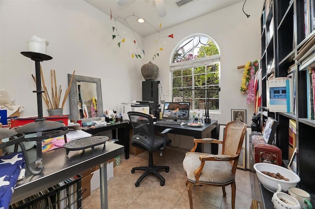 tiled home office with a towering ceiling