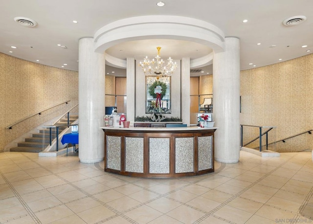 welcome area with an inviting chandelier