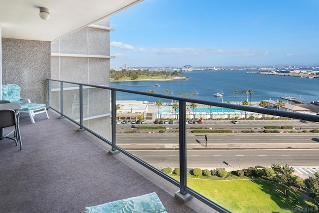 balcony featuring a water view