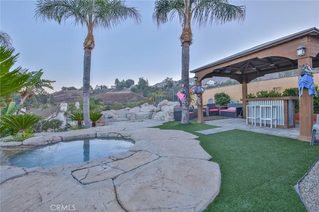 view of yard with a gazebo, an outdoor living space, and a patio