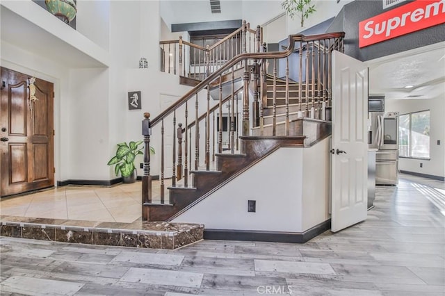 stairway with hardwood / wood-style flooring