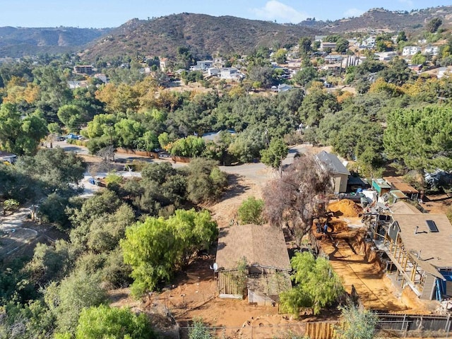 birds eye view of property with a mountain view