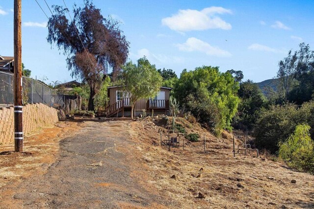 view of front of home featuring a wooden deck