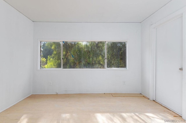 spare room with light hardwood / wood-style flooring