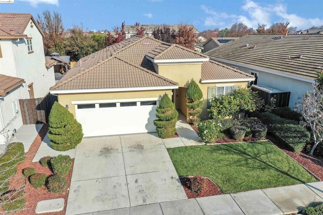 view of front facade featuring a garage and a front lawn