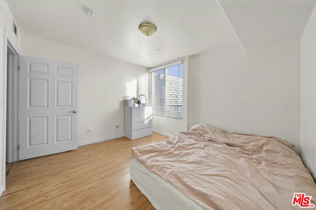 bedroom with wood-type flooring