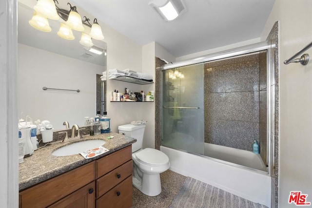 full bathroom featuring shower / bath combination with glass door, vanity, and toilet