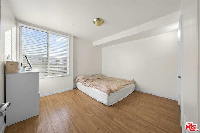 bedroom with light hardwood / wood-style floors