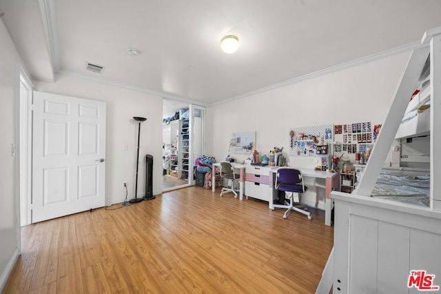 interior space featuring light hardwood / wood-style floors and ornamental molding