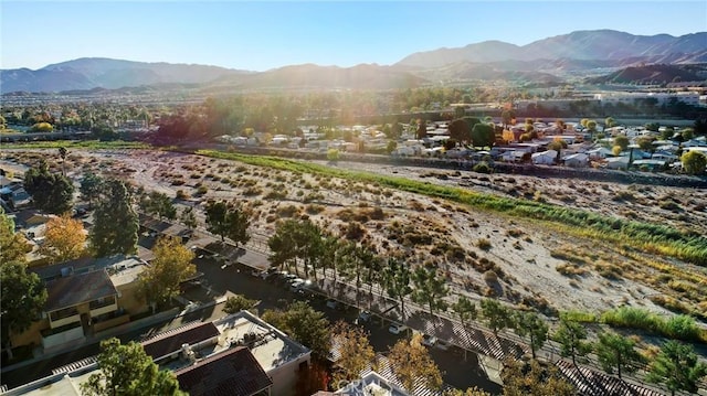 birds eye view of property featuring a mountain view