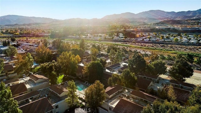 birds eye view of property with a mountain view