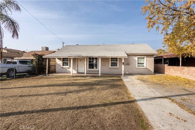 single story home with a porch