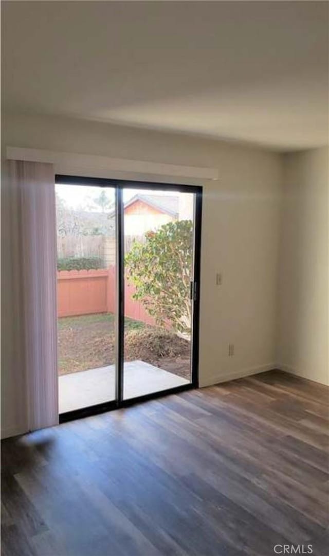 doorway with dark hardwood / wood-style flooring