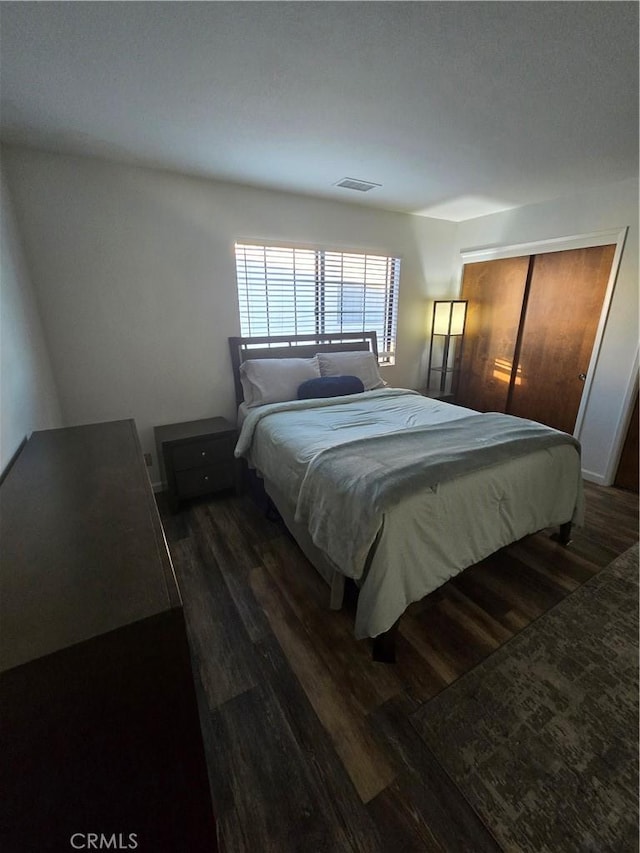 bedroom featuring dark hardwood / wood-style floors