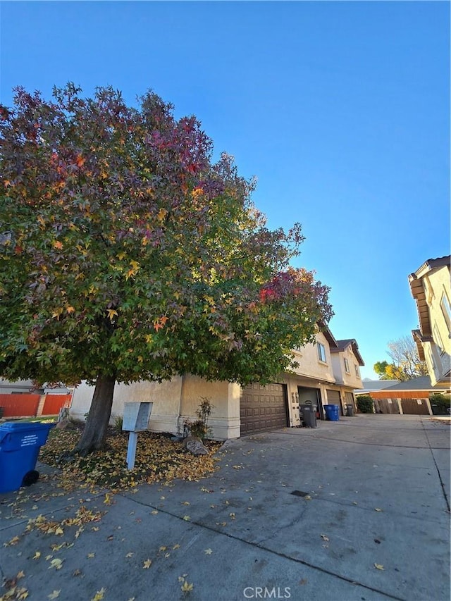 view of side of property featuring a garage