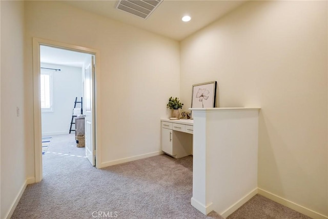 unfurnished office featuring light carpet