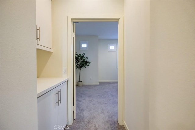 hallway with light carpet