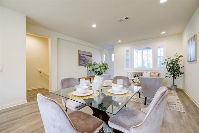 dining space featuring light hardwood / wood-style floors