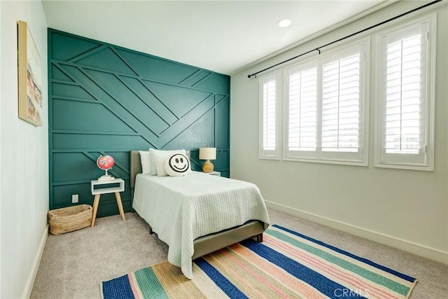 carpeted bedroom with multiple windows